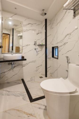 a bathroom with a white tub and a sink at Tritara Apartment in Kathmandu