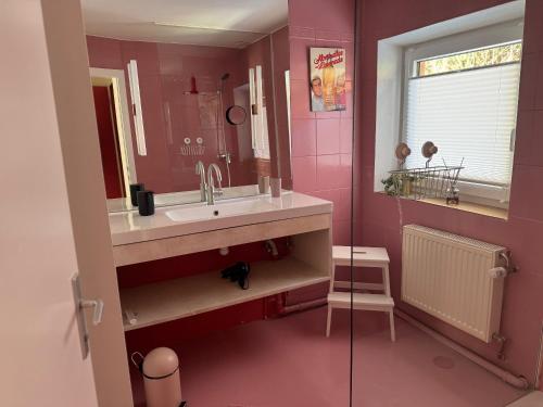 a bathroom with a sink and a mirror at Chalet Franzi - Ruhiges Chalet mit Bergblick, Garten und gratis Eintritt ins Solarbad in Dorfgastein