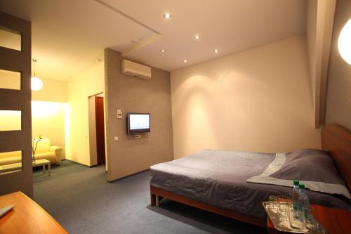 Кровать или кровати в номере Отель 55 Широта