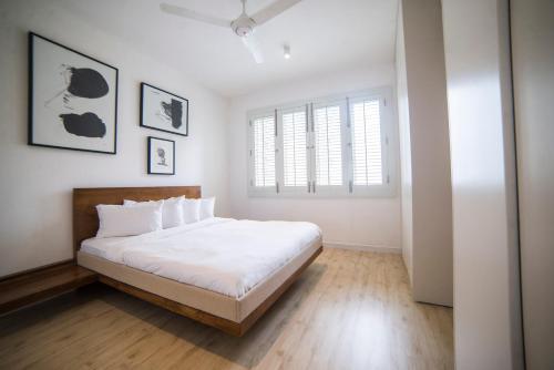 Säng eller sängar i ett rum på Luxe320