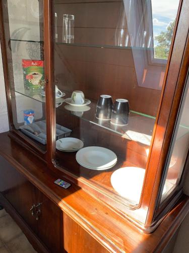 a counter with plates and toilets in a room at Studio 29 in Oberhausen