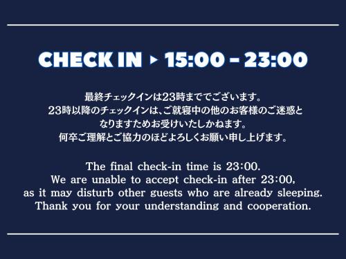 a sign with the words check in and a line at Guest House Umikaji in Naha
