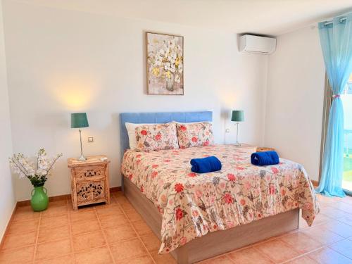 a bedroom with a bed with two pillows on it at Chalet Molly92 in Antigua