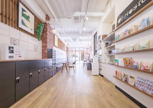 a large room with tables and shelves in a store at Hostel JAZ in Tokyo