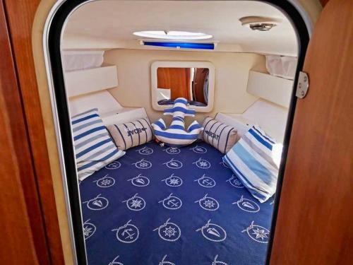 a view of the back of a room with pillows at Palermo Boat Experience in Isola delle Femmine