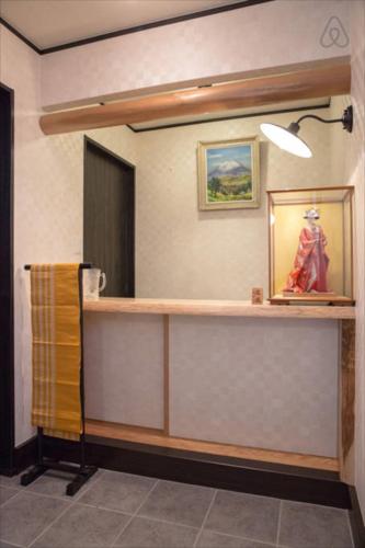 a bathroom with a counter and a mirror at Imagine Annex in Kyoto