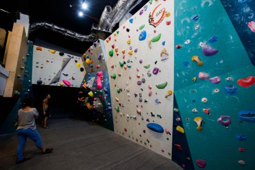 a person on a climbing wall in a gym at Jerusalem Inn by Smart Hotels in Jerusalem