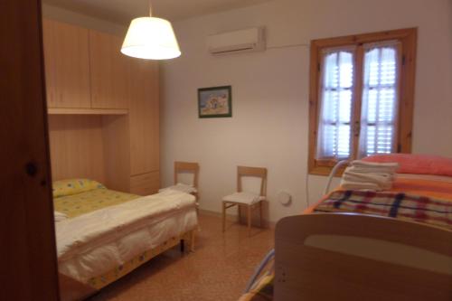 Postel nebo postele na pokoji v ubytování Villa Itaca