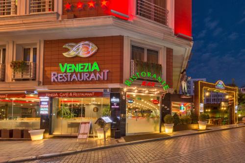 a store front of a restaurant at night at Vicenza Hotel Istanbul Old City in Istanbul