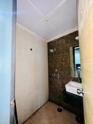 a bathroom with a sink and a mirror at Unique property in Ghaziabad