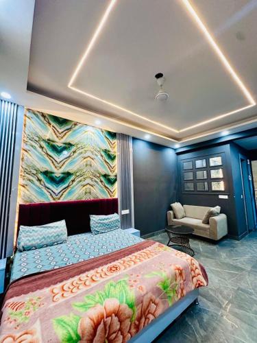 a bedroom with a bed and a painting on the wall at Unique property in Ghaziabad