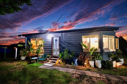 a small house with plants in front of it at Private Farmhouse & Paddock Available in Werribee South