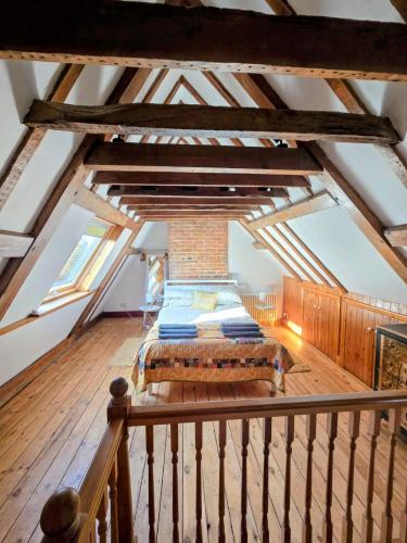a bedroom with a bed in a attic at Stunning 1 bedroom self contained apartment in Kent