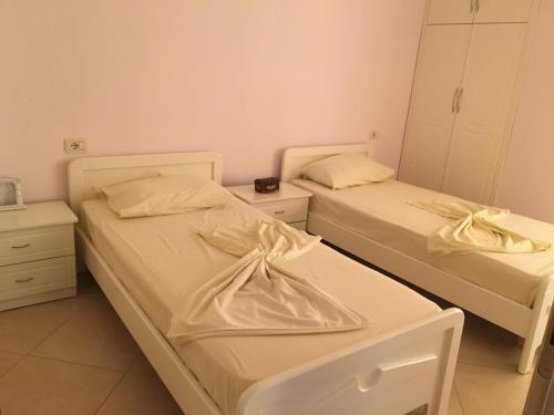 Postel nebo postele na pokoji v ubytování Saranda Central