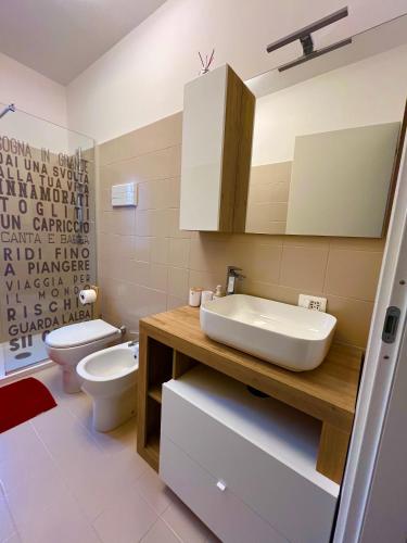 a bathroom with a sink and a toilet at BADIA del LAGO CLUSANE in Clusane sul Lago