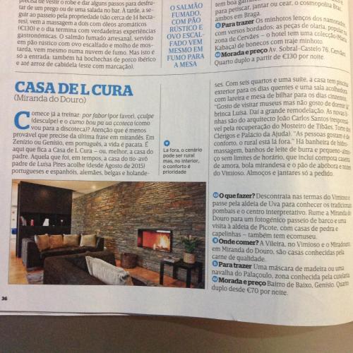 a article in a magazine about a living room at Casa de l Cura in Miranda do Douro