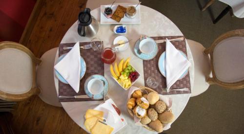a white table with food on top of it at B&B l'Heritage in Lo-Reninge