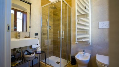 a bathroom with a shower and a toilet and a sink at Risorta Ponente in Boiano