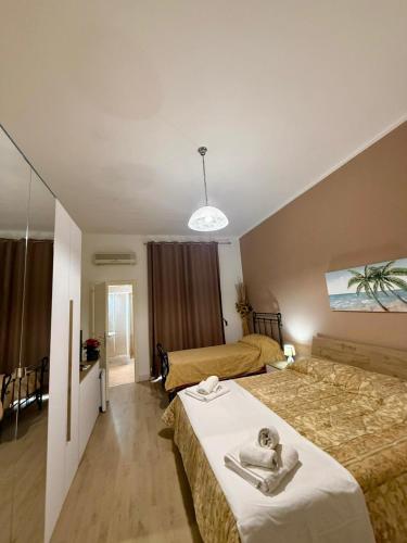 a hotel room with two beds in a room at Onda blu in Sant'Isidoro
