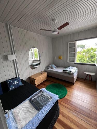 a room with two beds and a window at Garibaldi Guest House in Garibaldi