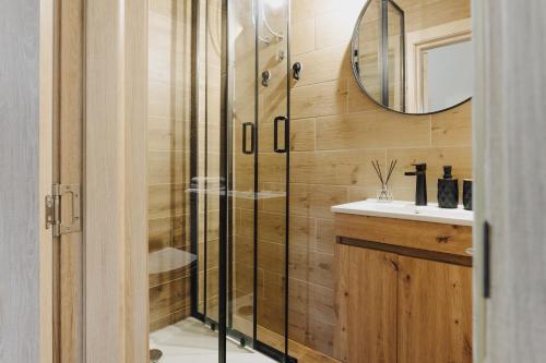 a bathroom with a shower and a sink at Mediterranean Holiday House & Apartments in Kotor