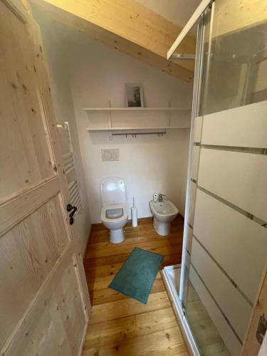 a small bathroom with a toilet and a sink at Openspace in legno La Casa sull'Albero in Osimo