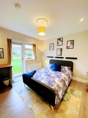 a bedroom with a large bed in a room at Private en-suite studio in Dunboyne