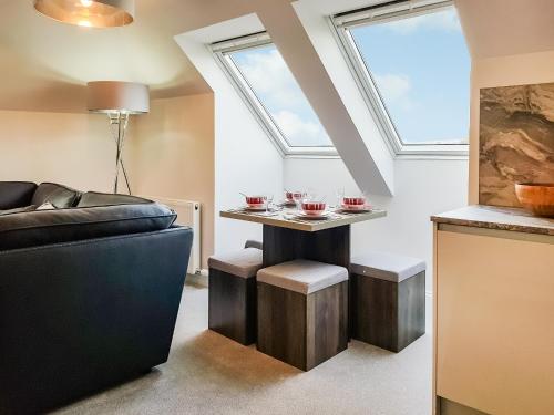 a living room with a table with glasses on it at Palace View - Uk40569 in Falkland