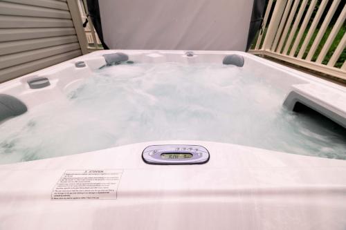 a hot tub with a thermometer on top of it at Castlewood Holiday Park in Antrim