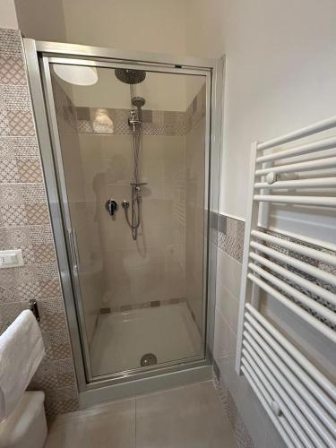 a shower with a glass door in a bathroom at Il Mare a due Passi in Pesaro