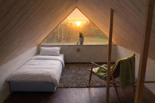 a room with a bed and a window in a tent at Sepasauna holiday house in Joaveski