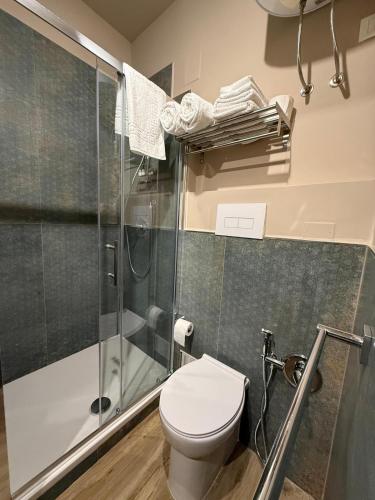 a bathroom with a toilet and a shower at Titti's Nest in Casteldaccia