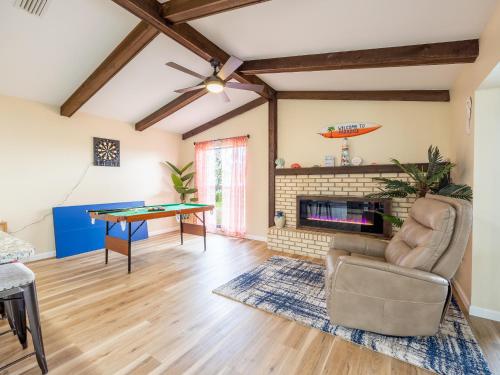 a living room with a ping pong table at Englewood, Manasota Keys - 2 Bedroom Luxury Villa, Pool, Game room, 6 min to Beaches next to Canal in Englewood