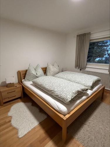 a bedroom with a bed and a window at Ferienwohnung Wasserfall in Golling an der Salzach