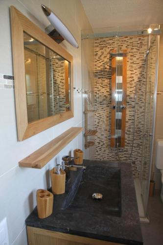 a bathroom with a sink and a shower at Chalet Ski in&out in Les Collons