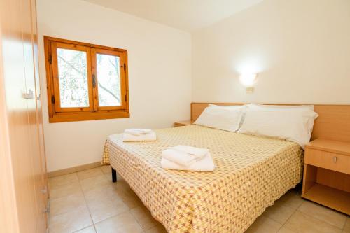 Krevet ili kreveti u jedinici u okviru objekta Centro Vacanze Oriente
