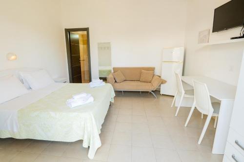Centro Vacanze Oriente tesisinde bir odada yatak veya yataklar