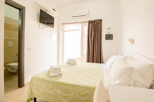 Llit o llits en una habitació de Centro Vacanze Oriente