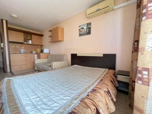 a bedroom with a large bed in a room at Nessebar, Studio,South Beach, Larisa in Nesebar
