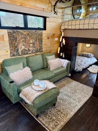 a living room with a couch and a bunk bed at Willow Court Farm, The Copper Castle & Petting Farm, 8 min to Legoland & Windsor, 15 min to Lapland UK in Windsor