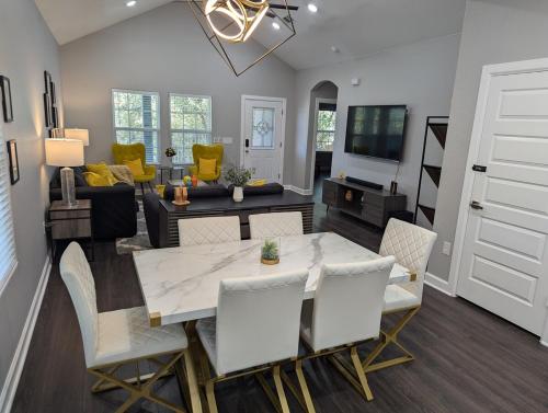 a dining room and living room with a table and chairs at Cheerful 3BR 2BA House Minutes from Canyon Lake in Canyon Lake