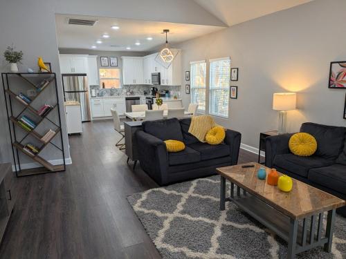 a living room with two couches and a table at Cheerful 3BR 2BA House Minutes from Canyon Lake in Canyon Lake