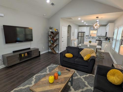a living room with a couch and a tv at Cheerful 3BR 2BA House Minutes from Canyon Lake in Canyon Lake