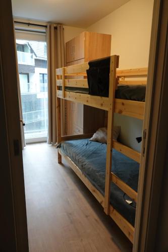 a bedroom with two bunk beds in a room at Madison A in Westende