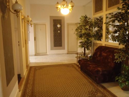 a living room with a couch and some plants at Hotel Green House in Teplice