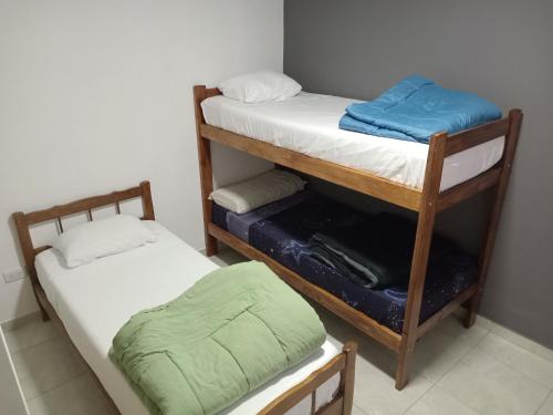 two bunk beds sitting next to each other in a room at Residencia Los Miottis in Necochea