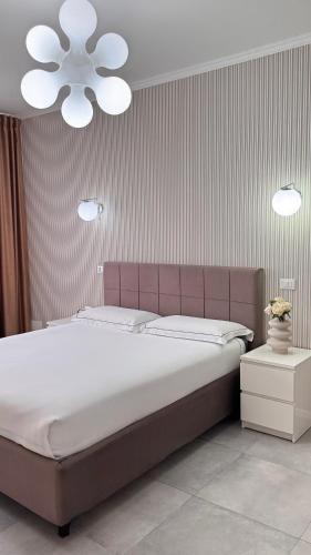 a bedroom with a large bed and a white ceiling at B&B Da Jana in Pordenone