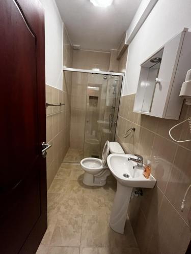 a bathroom with a toilet and a sink at Bilali Apartments in Ulcinj