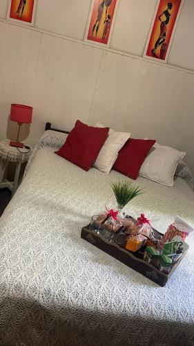 a bed with a tray of food on top of it at Antonia in San Nicolás de los Arroyos
