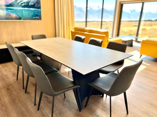 a conference room with a table and chairs at Guide Hill Station Lodge in Lake Tekapo
